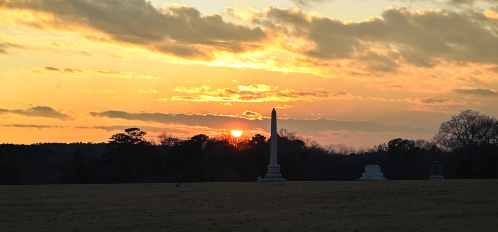 A sunset on the prison site facing the monument corner.