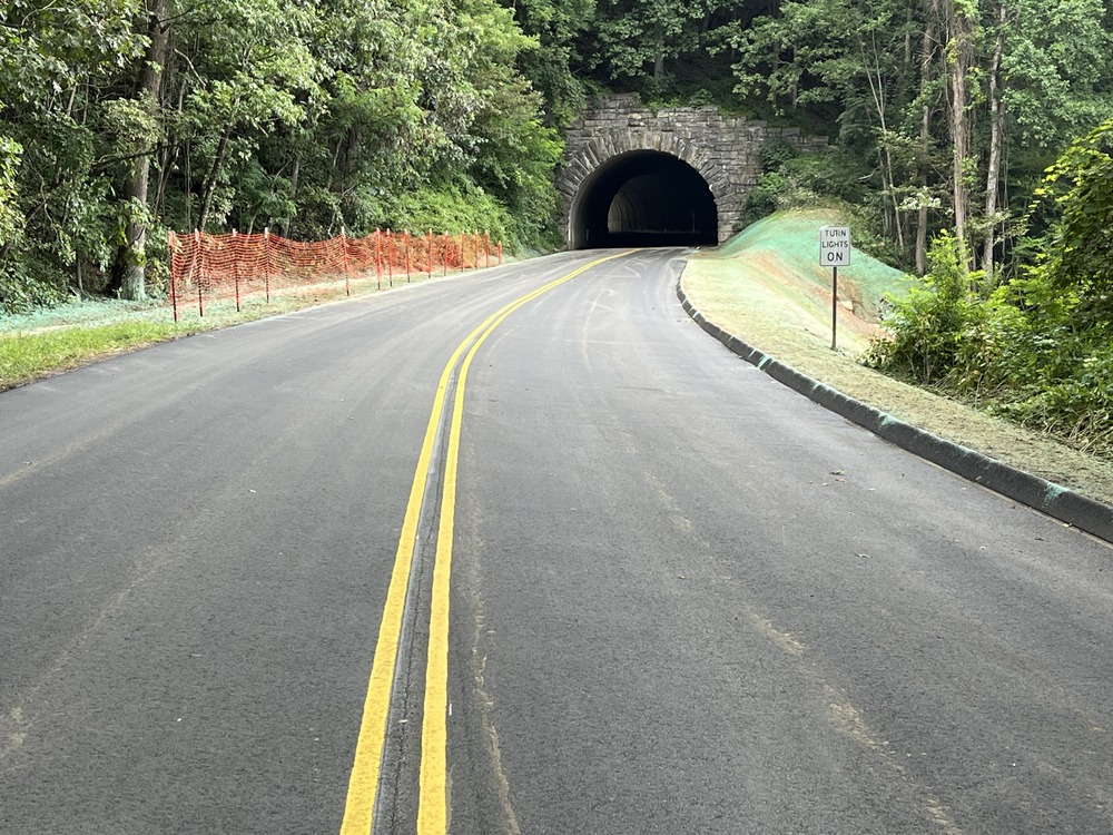 The newly paved motor road and rebuilt slope at milepost 401.6 with the Ferrin Knob Tunnel #3 in the background. 