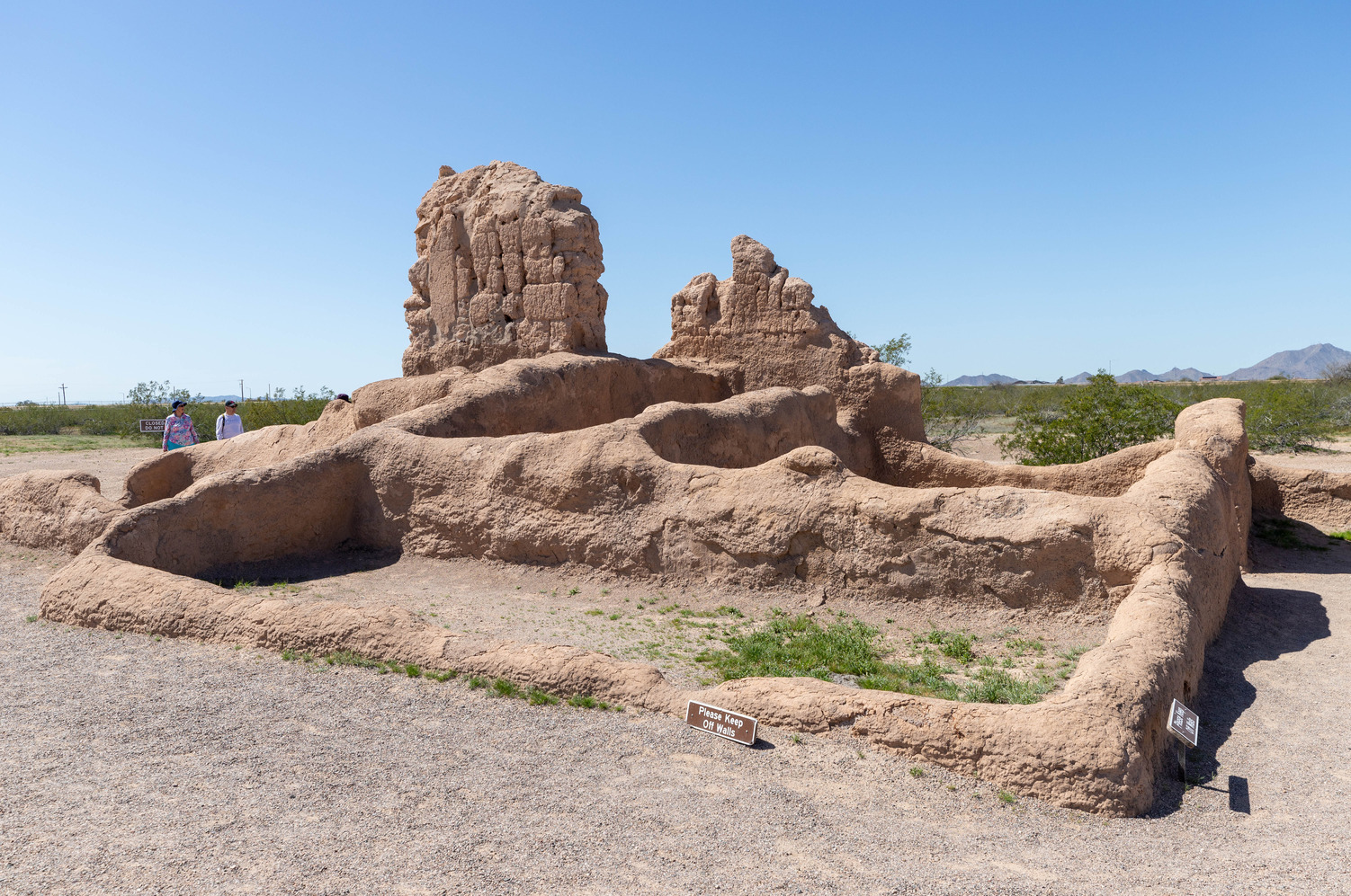 The foundation of a multi-room building, with some walls still partially intact. 