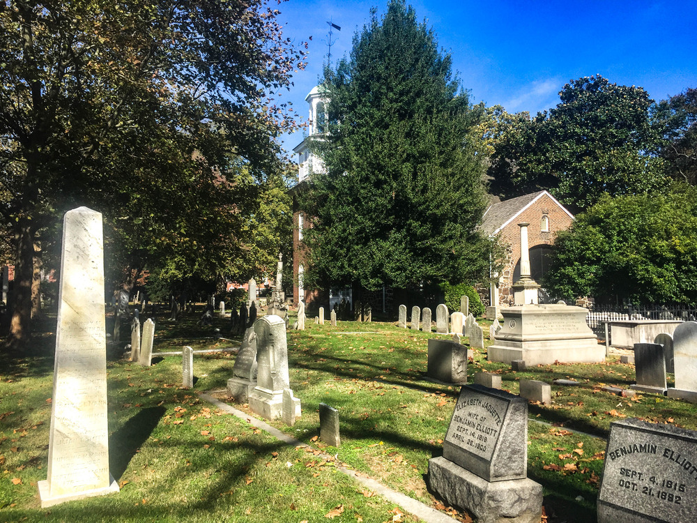 Brick church surrounded by a churchyard cemetery 